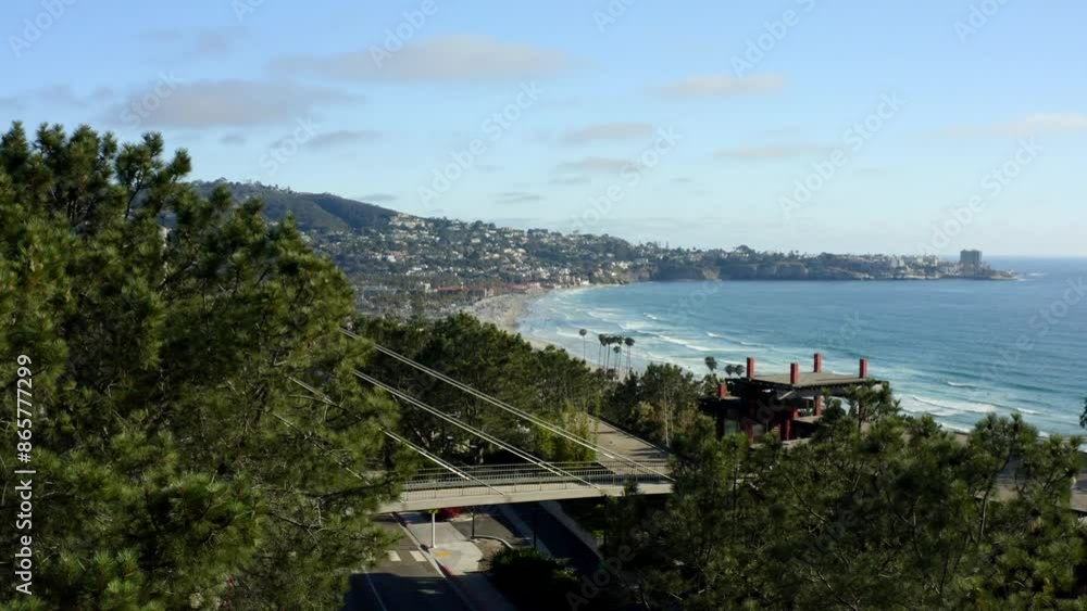 Aerial view looking over La Jolla into the Pacific Ocean on a sunny day with fluffy clouds San Diego coastline in California Aerial view looking over La Jolla into the Pacific Ocean on a sunny day with fluffy clouds San Diego coastline in California
