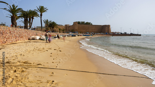 Town of Hammamet in Tunisia, Africa. View of ancient fort, coastline and fishing boats