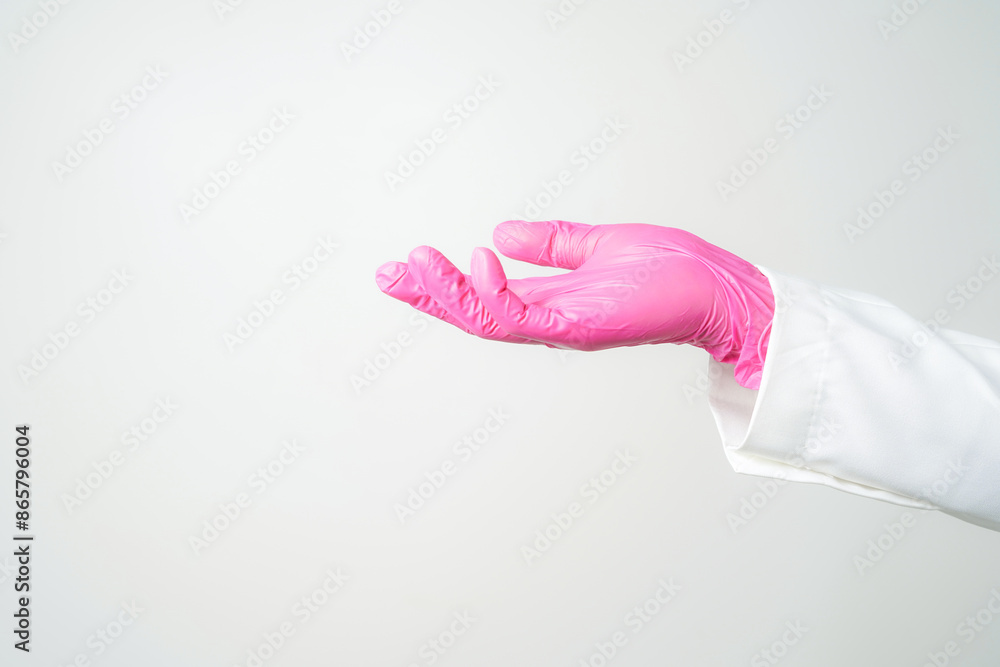Doctor or nurse hand in sterile gloves in holding position isolated on white Doctor or nurse hand in sterile gloves in holding position isolated on white