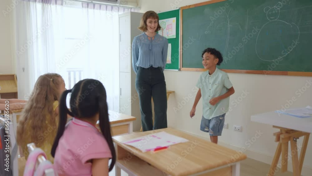 African American boy student dancing in front of classroom at school. African American boy student dancing in front of classroom at school.
