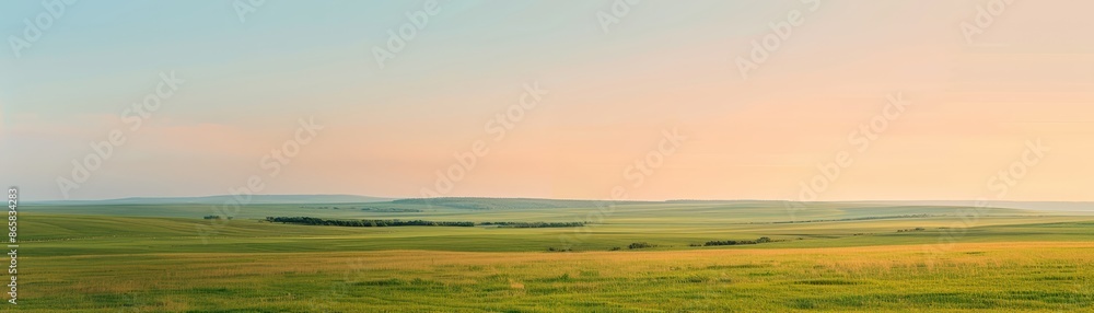 Beautiful sunrise over vast green fields and hills with a clear sky in the background, creating a serene and peaceful landscape scene. Beautiful sunrise over vast green fields and hills with a clear sky in the background, creating a serene and peaceful landscape scene.