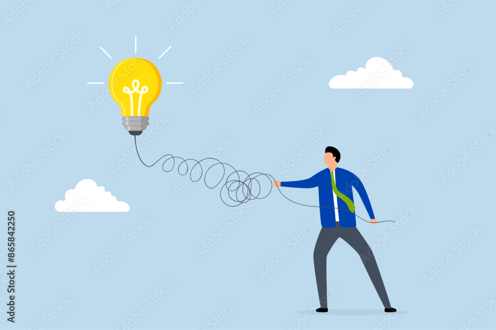 Simplify complex business idea, businessman unravels light bulb of amessy business idea. Simplify complex business idea, businessman unravels light bulb of amessy business idea.
