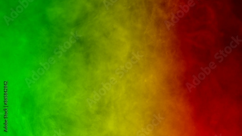 Photos abstract background smoke curves and wave reggae colors green, yellow, red color