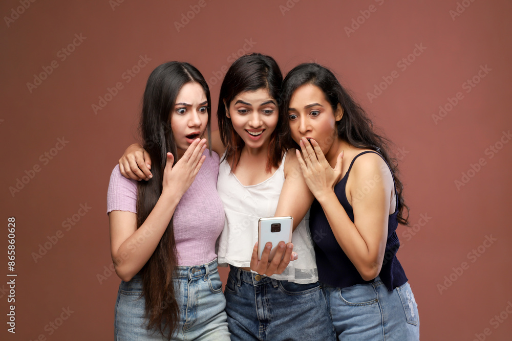 Three Women Were Shocked While Looking Something In Phone
Three Women Were Shocked While Looking Something In Phone