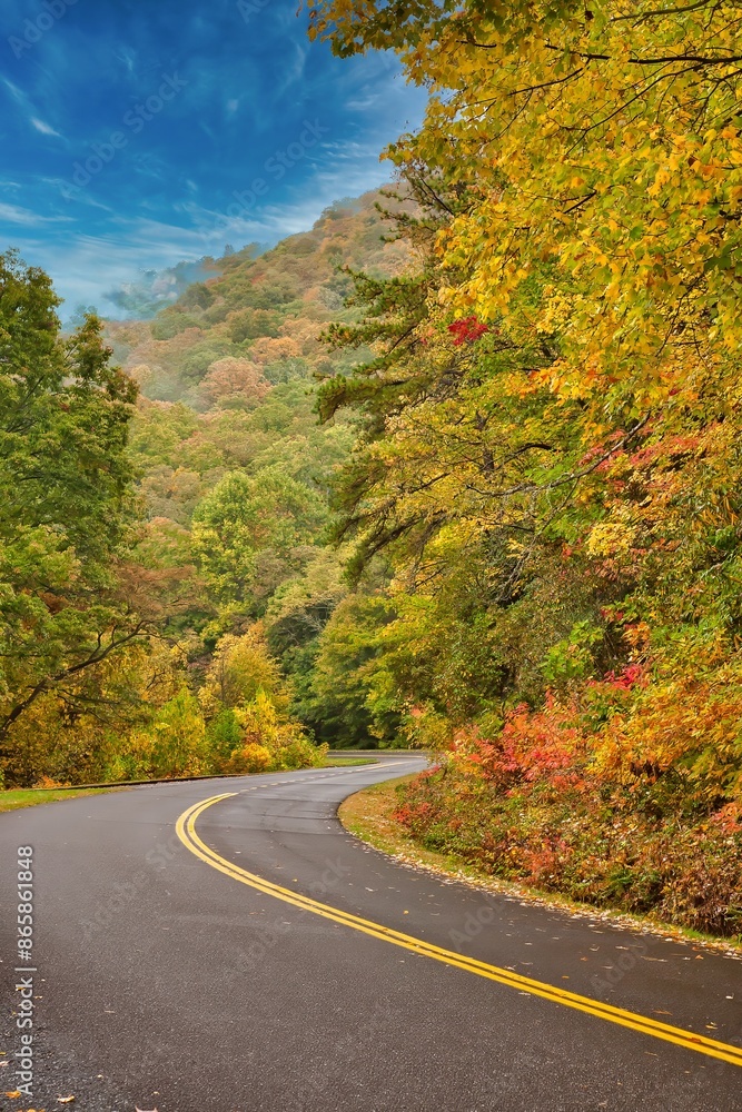 Winding road through Snoky Maountain National Park, Tennessee in the fall season Winding road through Snoky Maountain National Park, Tennessee in the fall season