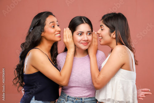 Three Glamorous Women Are Gossiping While Standing