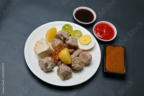 Siomay, a traditional Bandung dish, is a steamed dumpling made from mackerel fish and flour. It’s served with a rich peanut sauce, soy sauce, and chili sauce, offering a flavorful Indonesian culinary 