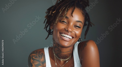 Portrait of a Smiling Woman With Dreads and Tattoos