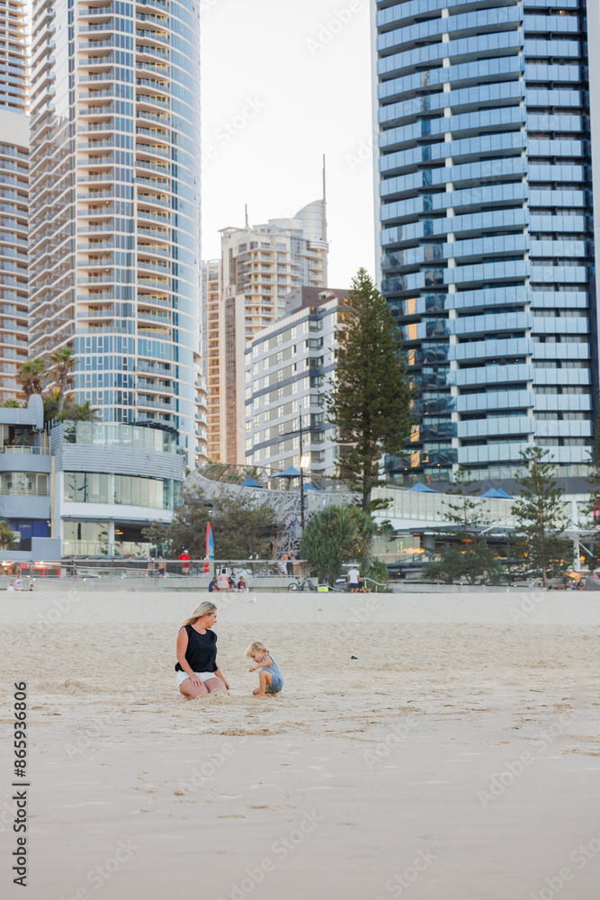 Mother and son playing in the sand on Main Beach at Surfers Paradise on the Gold Coast Mother and son playing in the sand on Main Beach at Surfers Paradise on the Gold Coast