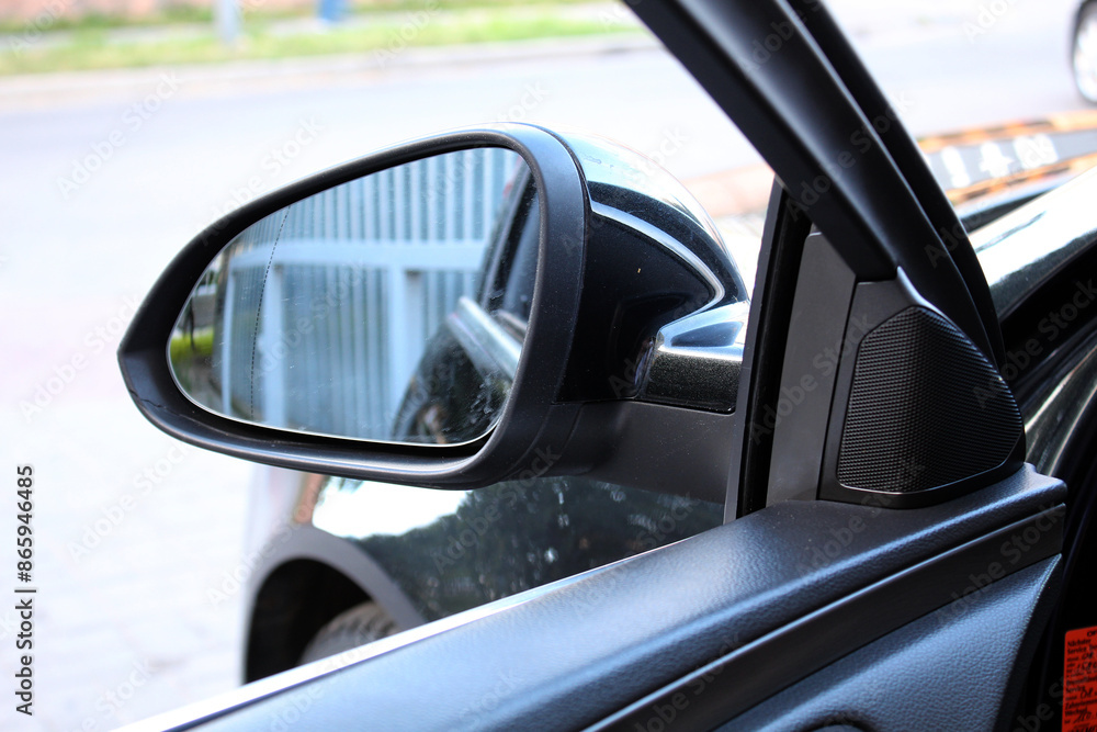 Car mirror with rear view reflection. Side rear-view mirror on a car. Car mirror with rear view reflection. Side rear-view mirror on a car.
