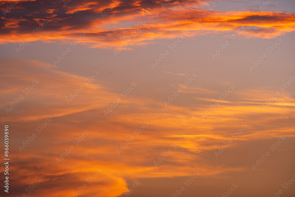 Fototapeta premium Dramatic sunset or sunrise scene. Pink and purple summer clouds against blue sky