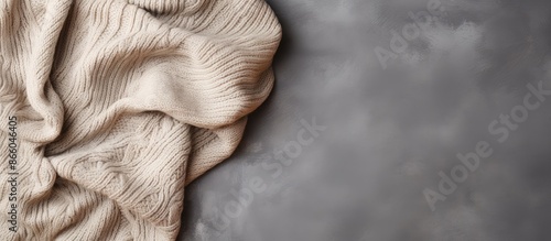 A beige knitted blanket on ...