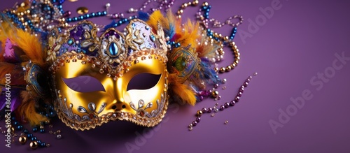 Wallpaper Mural Studio photo of a golden carnival mask adorned with colorful beads against a violet backdrop with ample copy space image. Torontodigital.ca