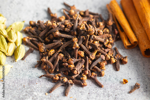 selective focus of Laung Clove, Indian spice with ceramic background.  photo