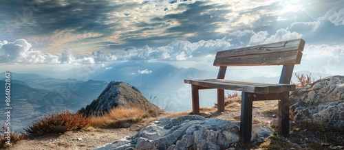 Bench on mountain peak over...