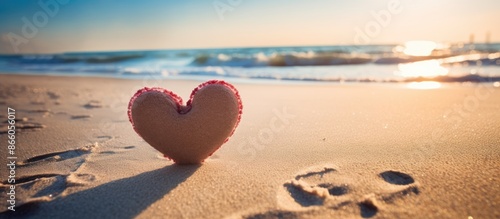 Heart drawn on sandy beach ...