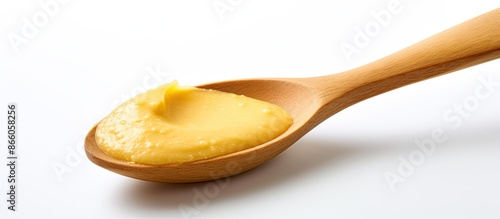 A wooden spoon rests on a w...