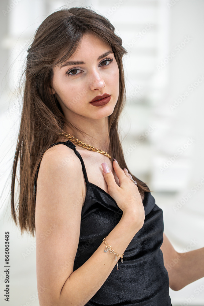 Portrait of a young girl in a long black evening dress Portrait of a young girl in a long black evening dress