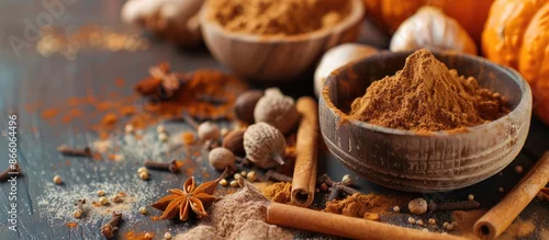 Obraz  z motywem Essential spices for pumpkin spice include cinnamon, nutmeg, allspice, clove, and ginger with copy space image.