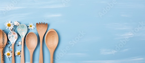 Wooden utensils on blue flo...