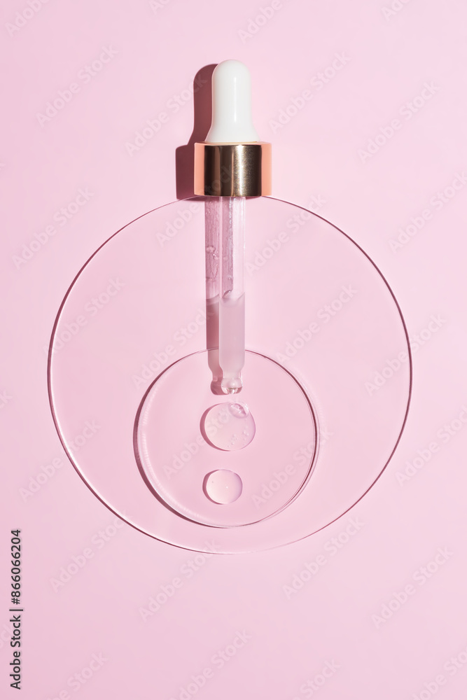 Close-up pipette with a hyaluronic moisturizing serum on a pink background. Beauty skin care concept research. Beauty and spa. Close-up pipette with a hyaluronic moisturizing serum on a pink background. Beauty skin care concept research. Beauty and spa.