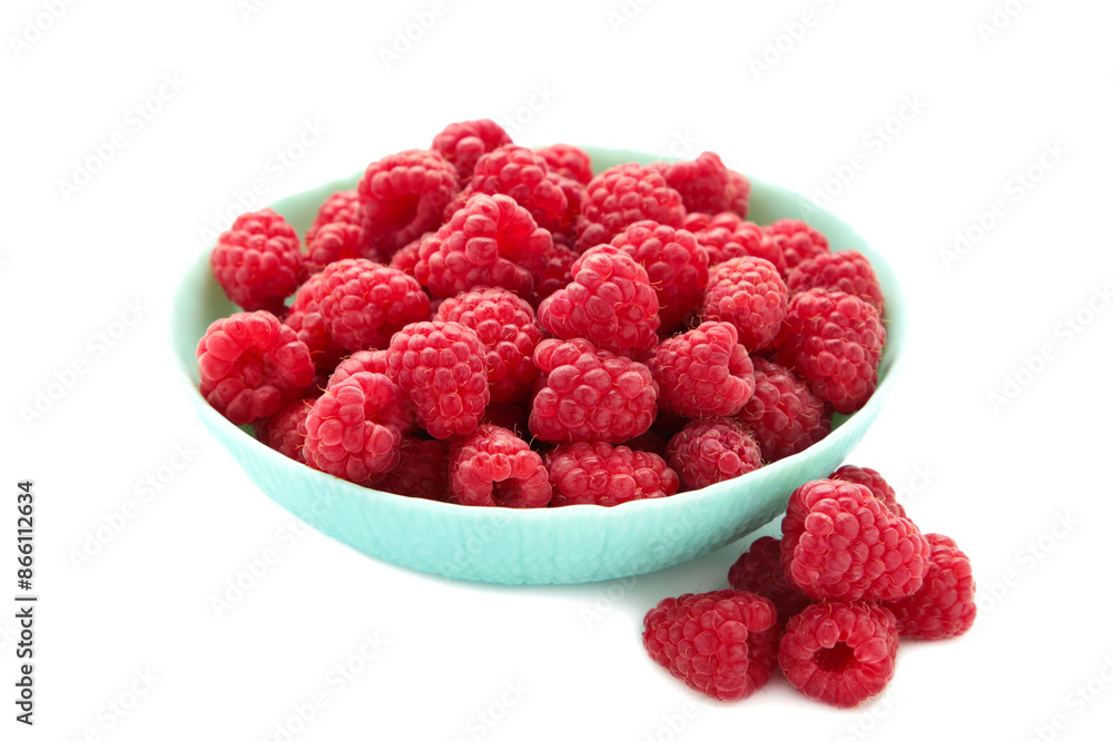 Raspberries in mint bowl isolated on white background Raspberries in mint bowl isolated on white background