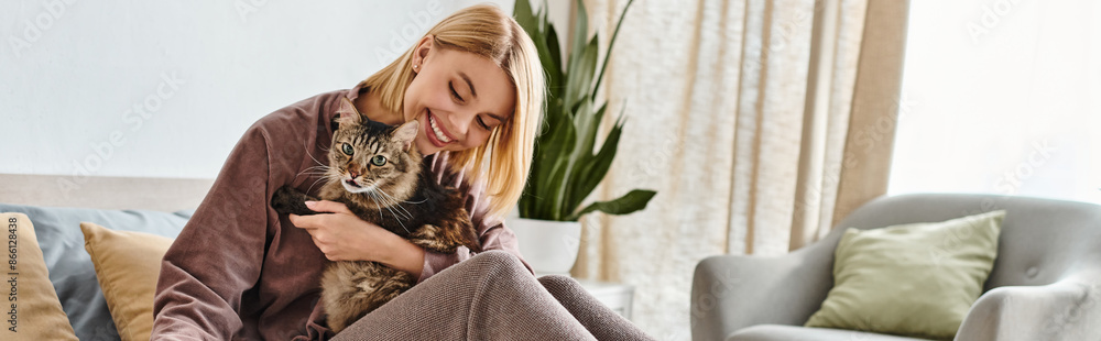 A woman with short hair lovingly holds her cat in her arms, showing affection and bond between human and pet. A woman with short hair lovingly holds her cat in her arms, showing affection and bond between human and pet.