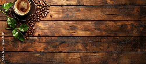 Coffee cup and coffee beans on a wooden table with copy space image. photo