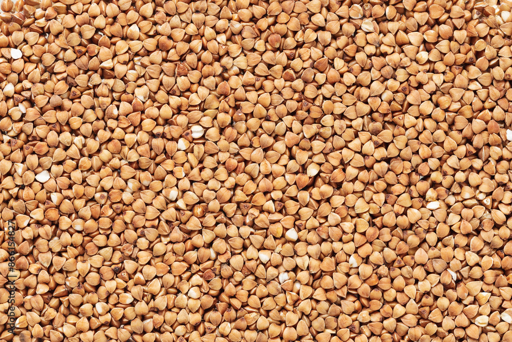 Texture of ripe peeled buckwheat top view . Texture of ripe peeled buckwheat top view .