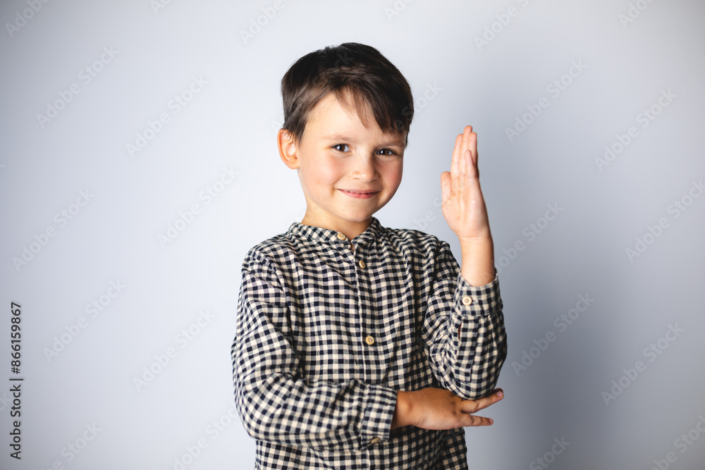 Diverse elementary school students raising his hand to answer teacher questions, standing isolated on white background. Back to school concept. Diverse elementary school students raising his hand to answer teacher questions, standing isolated on white background. Back to school concept.
