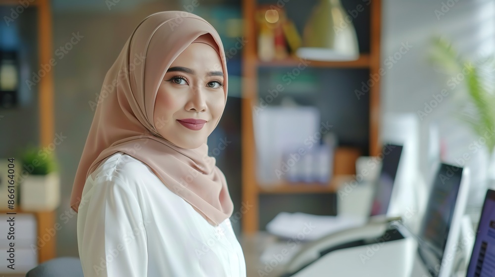 Malay female employee in the office Malay female employee in the office