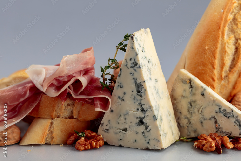 Prosciutto with blue cheese, baguette, walnuts, and thyme. Prosciutto with blue cheese, baguette, walnuts, and thyme.