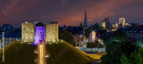 York at night, Yorkshire city of York and Cliffords Tower at night with York Minster in the background. Aerial view of York, medieval roman city photo