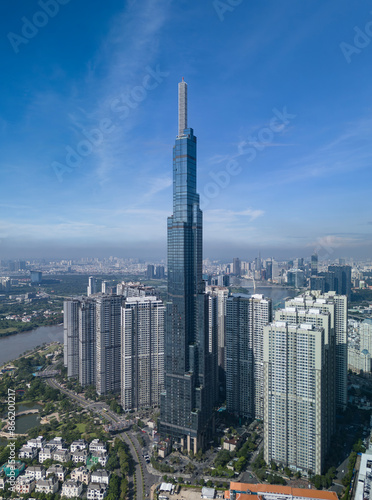 Landmark building and Central park looking to the Saigon River on beautiful sunny day with blue skies showing impressive architecture and landscaping in Ho Chi Minh City, Vietnam