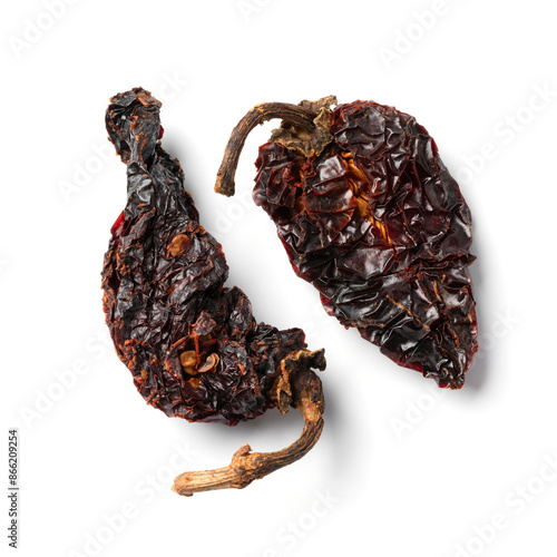 Pair of smoked Mexican chile chipotle Morita pepper isolated on white background close up photo