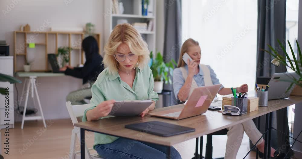 Corporate Employee Focused on Document Analysis Corporate Employee Focused on Document Analysis