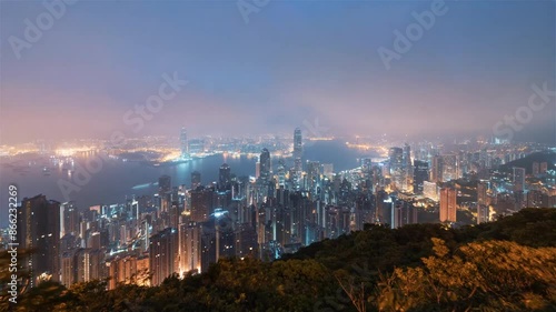 Aerial hyperlapse, dronelapse video of Hong Kong city at night photo