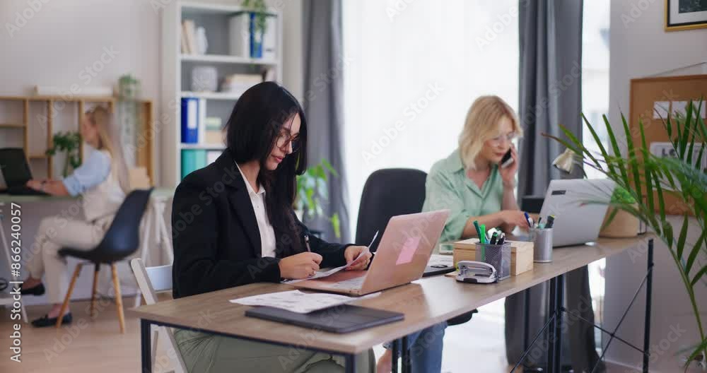 Self-Confident Woman Working on Project in Office Self-Confident Woman Working on Project in Office