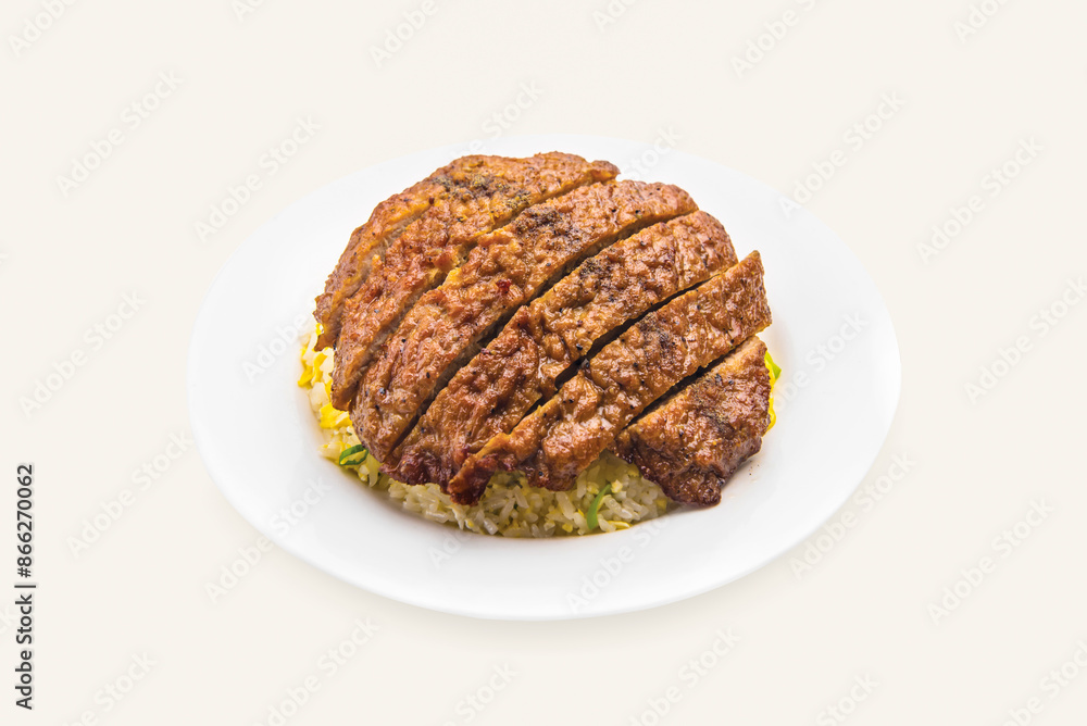 Pork Chop Fried Rice served in plate isolated on grey background side view of hong kong food Pork Chop Fried Rice served in plate isolated on grey background side view of hong kong food