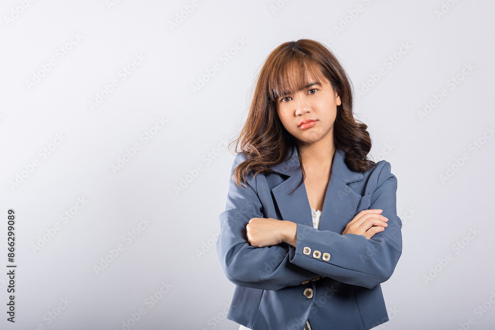 Asian happy portrait beautiful business young woman wearing a suit angry and mad raising fist frustrated and furious while shouting with anger isolated, studio shot on white background and copy space Asian happy portrait beautiful business young woman wearing a suit angry and mad raising fist frustrated and furious while shouting with anger isolated, studio shot on white background and copy space