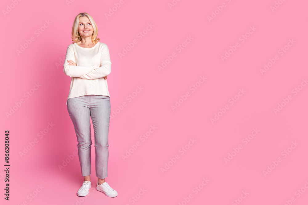Photo of pretty lovely adorable woman dressed stylish clothes look empty space isolated on pink color background Photo of pretty lovely adorable woman dressed stylish clothes look empty space isolated on pink color background
