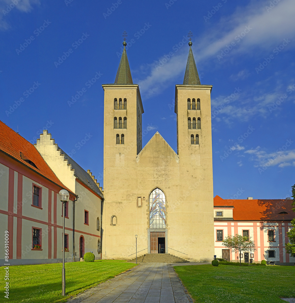 Obraz premium View of the Premonstratensian Monastery from 12th century and the Romanesque church of Annunciation of Virgin Mary in Milevsko, Czech republic
