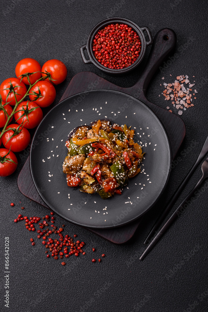 Spicy Asian dish with sliced meat fillet, hot pepper, carrots and sesame seeds Spicy Asian dish with sliced meat fillet, hot pepper, carrots and sesame seeds