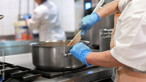 Wallpaper Mural Chefs cooking food in commercial kitchen. High quality 4k footage Torontodigital.ca