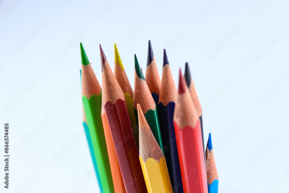 a bunch of colored pencils isolated on white background close up a bunch of colored pencils isolated on white background close up