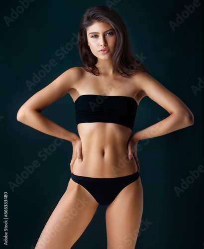 Woman, portrait and body for health in studio, underwear and stomach for diet wellness or weight loss. Pride, girl and lingerie for exercise progress, cardio results and balance on black background