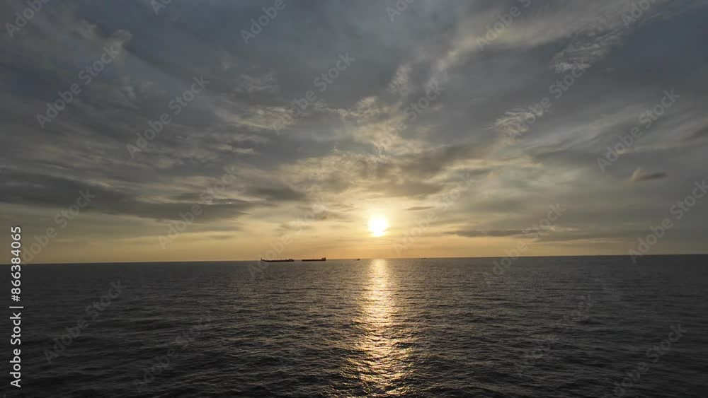 Two offshore oil tankers during crude oil transfer in the middle of the ocean during sunset
Two offshore oil tankers during crude oil transfer in the middle of the ocean during sunset
