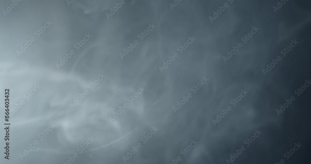 Ambient, abstract smoke and light motion background. Strange, glowing, alien, UFO light, ghost or spirit with smoke and fog for halloween or science fiction, sci-fi background.