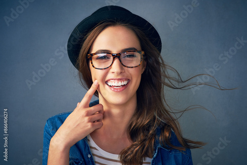 Obraz na plátně Girl, portrait and glasses in studio for eyecare or optometry, wellness and prescription for clear vision with happiness