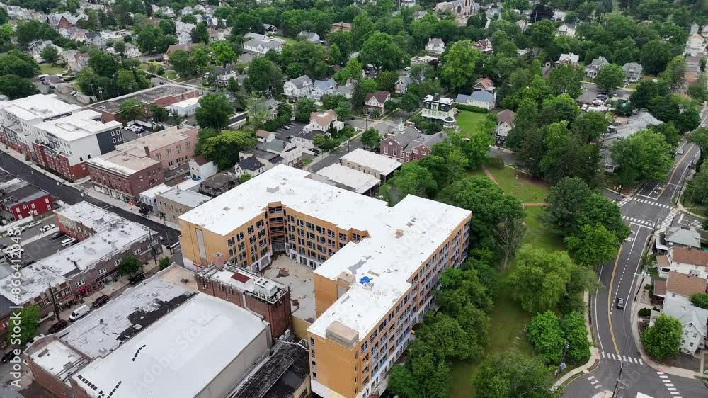 Drone cityscape view of Bound Brook town showcasing urban buildings, road traffic and green trees Drone cityscape view of Bound Brook town showcasing urban buildings, road traffic and green trees